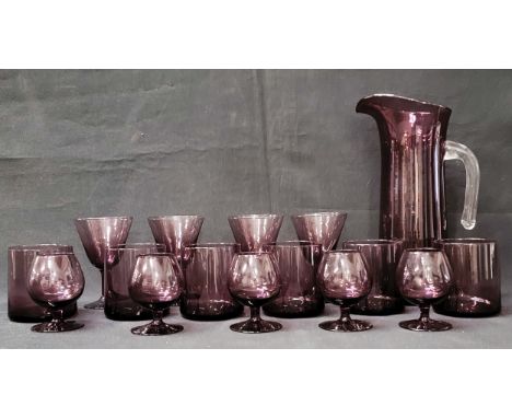 MID CENTURY STUDIO ART GLASS AMETHYST LEMONADE PITCHER AND GLASSESconsisting of pitcher with clear glass handle, six tumblers