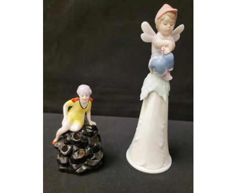 LLADRO FAIRY/ELF BELLwith fairy sitting on top of a leaf shaped bell, 20cm high; together with a ceramic Art Deco flapper gir