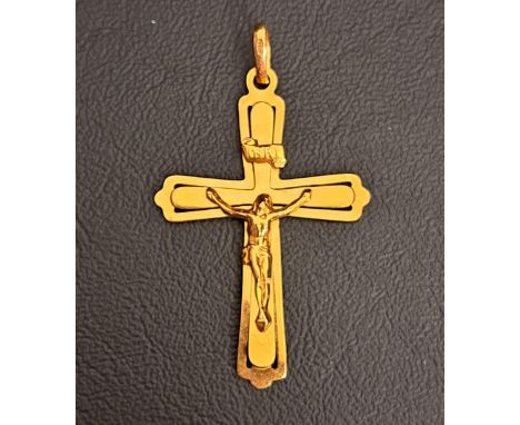 NINE CARAT GOLD CRUCIFIX PENDANT5.4cm high including suspension loop and approximately 3.3 grams