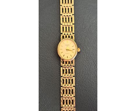 LADIES NINE CARAT GOLD CASED ROTARY WRISTWATCHon nine carat gold bracelet strap, the oval dial with baton five minute markers