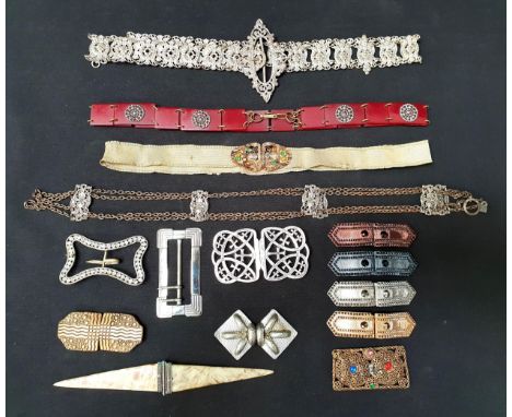 VINTAGE BELTS AND BUCKLESincluding two white metal belts, a plated nurses belt buckle, four shoe adornments or various colour
