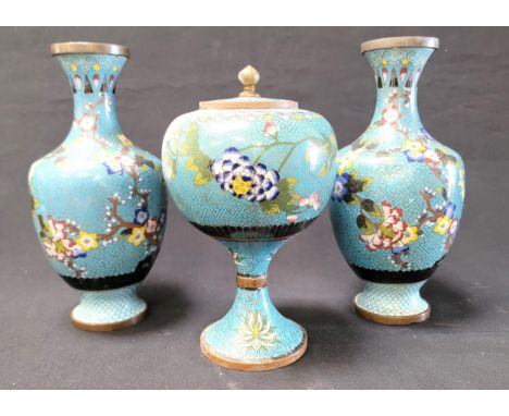 PAIR OF CLOISONNE VASESalongside an urn, each with matching decorative floral decoration on light blue ground, the vases 24cm