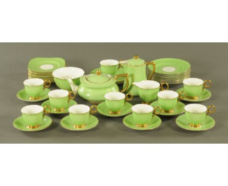 A Sutherland china tea service, green and gilt, 12 plates, 10 square shaped saucers/plates, 9 saucers, 10 cups, sugar basin, 