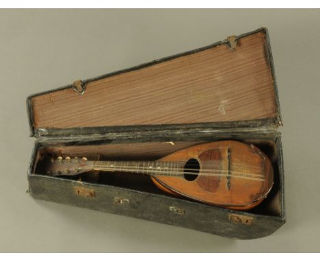 A vintage Stridente mandolin, eight string and with label "Stridente Fabrica di Mandolini Via Antonio, 22 Napoli", cased and 