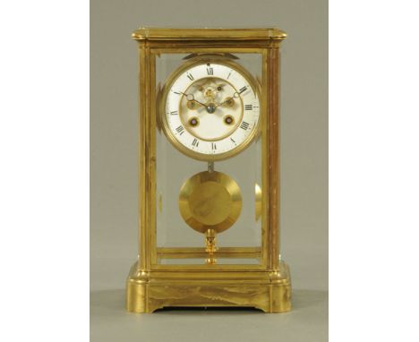 An Edwardian brass library clock, with visible Brocot escapement and large pendulum.  Height 30 cm, width 17 cm, depth 13.5 c