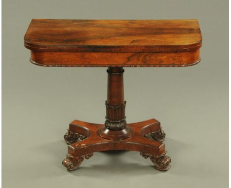 A Regency/William IV rosewood turnover top card table, with moulded edge turned centre column, quatreform base and scroll fee