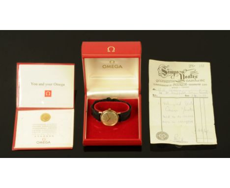 A 1968 gentleman's 9 ct gold cased Omega wristwatch, with silvered dial, manual.  Case diameter 34 mm with original receipt, 