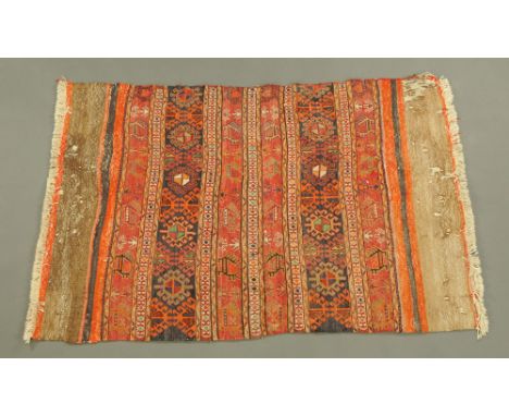 A vintage Kilim rug, multi coloured with fringed ends.  173 cm x 112 cm