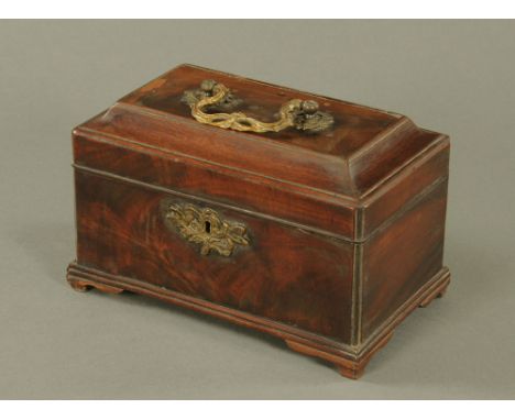 A George III mahogany three division tea caddy, the shaped top with pierced ormolu swan neck handle and raised on bracket fee