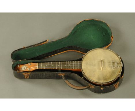 A vintage John Grey &amp; Son of London banjo, cased.  Length 55 cm.