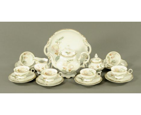 A Hutschenreuther Magnolia patterned tea service, six place settings, 6 cups, 6 saucers, 6 side plates, sugar basin, cream ju