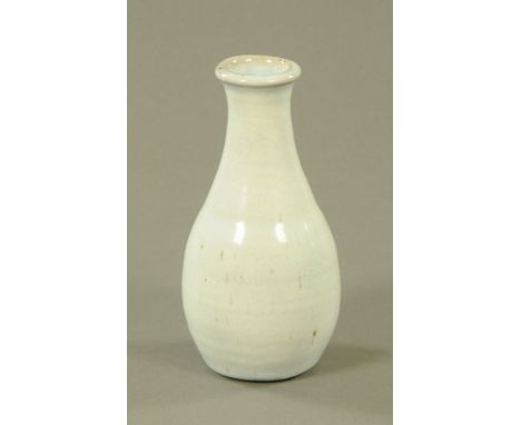 Edward Hughes (1953-2005), a studio pottery vase, light blue glaze, impressed mark.  Height 21 cm.