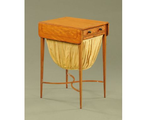 A 19th century satinwood worktable, twin drop flap with frieze drawer and sliding bag raised on tapered legs of square sectio