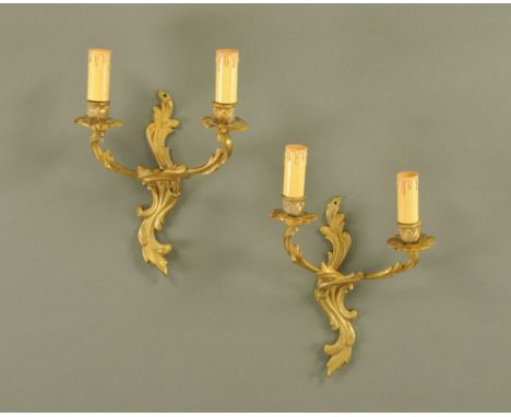 A pair of rococo style twin light sconces.  Height including faux candle holders 35 cm.