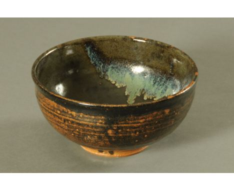 Jim Malone (born 1946), a studio pottery bowl, principal colours dark brown and green.  Diameter 24 cm. CONDITION REPORT: Thi