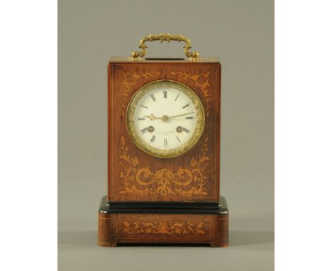 A 19th century French rosewood cased mantle clock by FL Hausburg Paris, with two train spring driven movement.  Height exclud