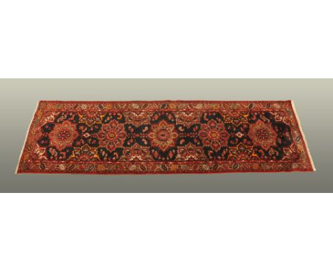 A fine hand knotted Persian runner, North West region.  2.98 m x 0.95 m (see illustration).