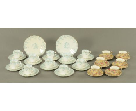 A Foley china blue white and gilt tea service, comprising 2 large plates, 10 cups, 10 saucers and 10 side plates, together wi