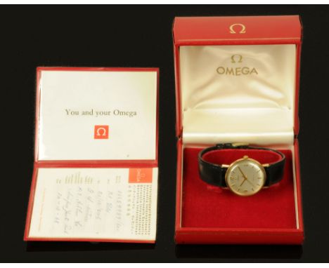 A 9 ct gold cased gentleman's Omega wristwatch, 1968, manual with original buckle, case diameter 34 mm with box and papers. C