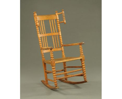 A 19th century Westmorland bobbin turned kitchen rocking chair.