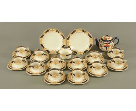 An Alfred Meakin Caledonian tea service, comprising 12 cups, 12 saucers, 11 plates, 2 large plates and sugar basin, together 