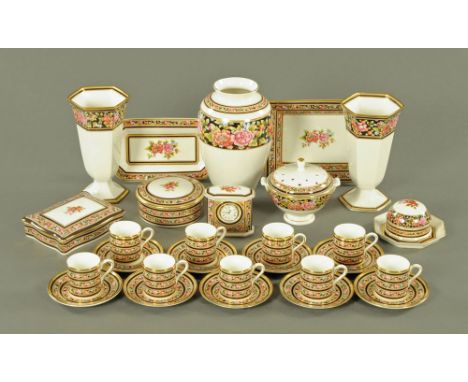 A collection of Wedgwood Clio wares, comprising 9 coffee cups, 9 saucers, pair of vases, quartz clock, various lidded bowls e