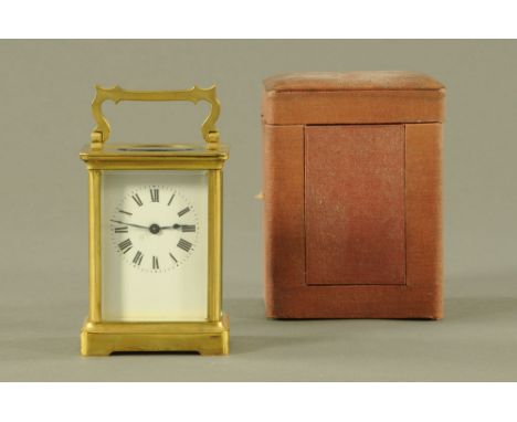 A French brass carriage clock, timepiece only, cased and with key.  Height excluding carrying handle 11 cm.