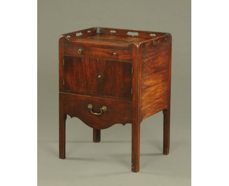 A George III mahogany commode cabinet, with drawer above a cupboard and with slide beneath and with furnished interior.  Heig