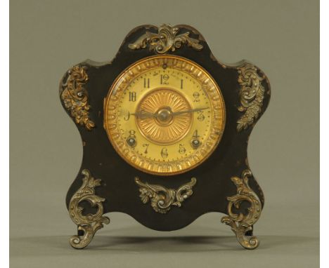 An Ansonia American tin plate cased mantle clock, with two train striking movement.  Height 24 cm, width 21.5 cm.