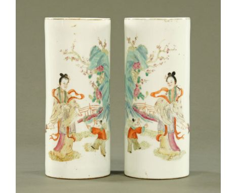 A pair of Chinese cylindrical vases, decorated with figures and fence with square seal mark to base.  Height 28 cm. CONDITION