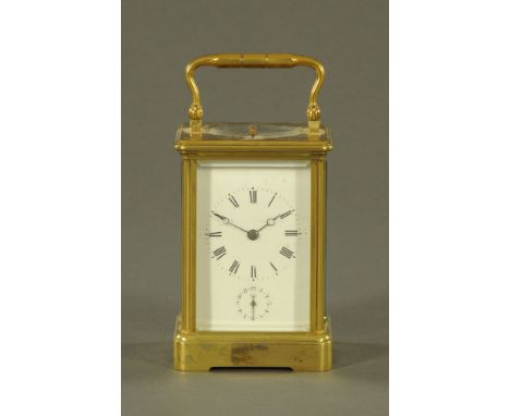 A late 19th/early 20th century French brass carriage clock, two train striking on a gong and with repeat mechanism and alarm.