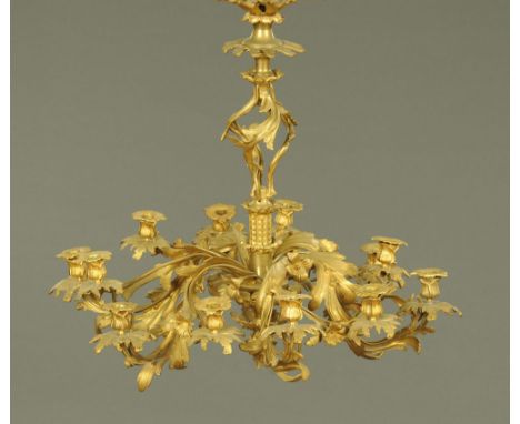 A rococo style centre light fitting, twelve branch.  Height excluding suspension chain 76 cm, width +/- 62 cm.