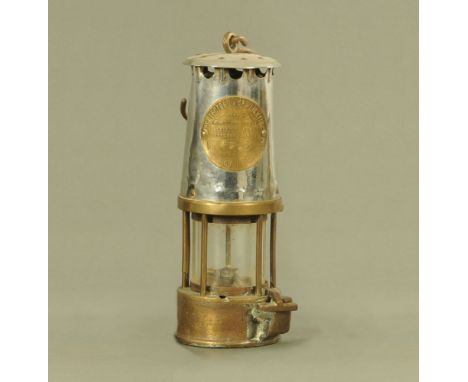 A Protector Lamp &amp; Lighting Co Ltd Eccles brass miners lamp.  Height excluding handle 22 cm.
