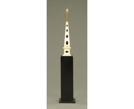 A marble obelisk lamp, the obelisk possibly 19th century.  Height of obelisk itself 47 cm.  Height to top of light fitting 12