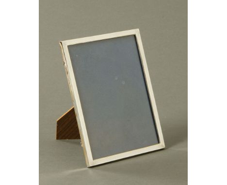 A silver easel backed photograph frame, engine turned, import mark for 1975.  External dimensions 26 cm x 20 cm.