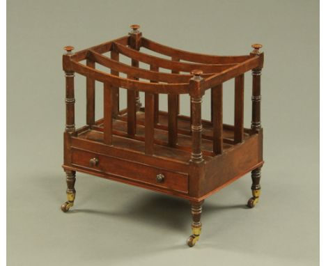 A 19th century mahogany Canterbury, with three divisions with mushroom shaped terminals with frieze drawer and short turned l