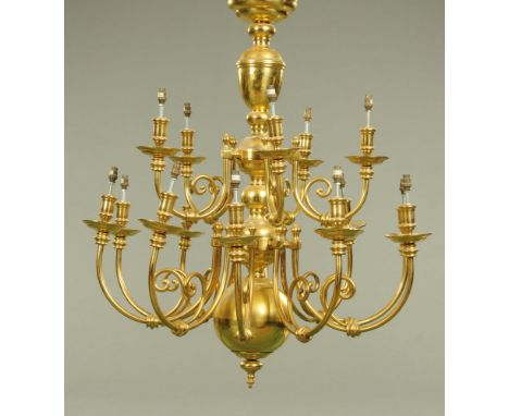 A large heavy brass chandelier type centre light fitting, fifteen branch.  Height excluding hanging chain 100 cm, width +/- 9