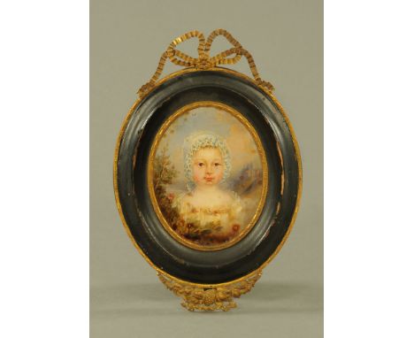 A 19th century primitive portrait miniature of a young girl in landscape, in wooden and metal frame.  Overall height 25 cm, w
