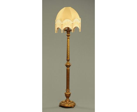 An electric floor standing giltwood lamp standard, with fine handmade beaded shade (see illustration).