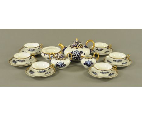 A Czechoslovakian blue, white and gilt tea service, 6 cups, 6 saucers, 6 plates, teapot, lidded vessel, sugar basin and cream