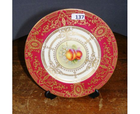 A pretty Royal Worcester cabinet plate, signed by H Aynton, hand gilded and painted with fruit.