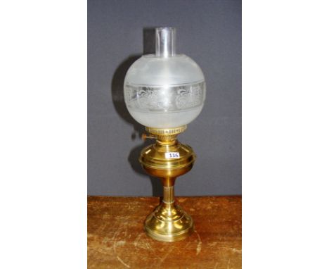A brass oil lamp.