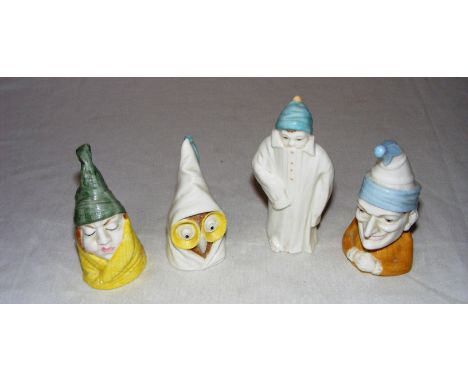 Four Royal Worcester candle snuffers.