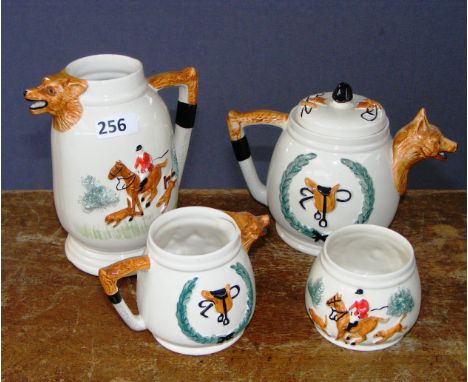 A part tea service in the form of a fox.