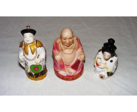 Three Royal Worcester candle snuffers.
