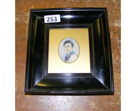 A small head and shoulders portrait of a boy, in an ebonised wooden frame with gilt card mount.