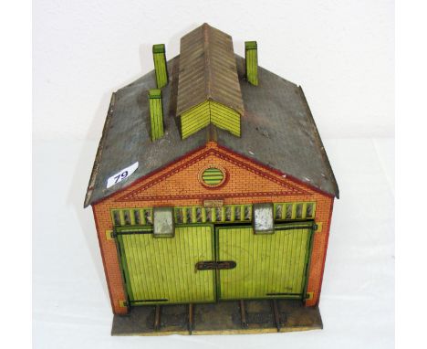 A Hornby tin plate engine shed.