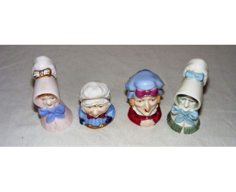 Four Royal Worcester candle snuffers.