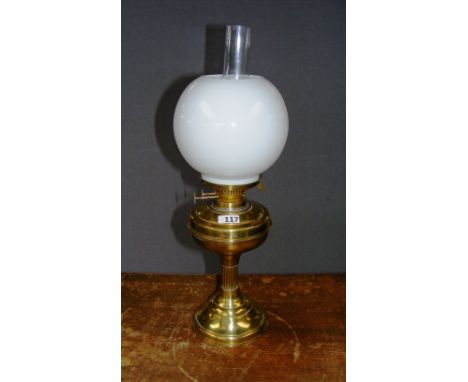 A brass oil lamp.