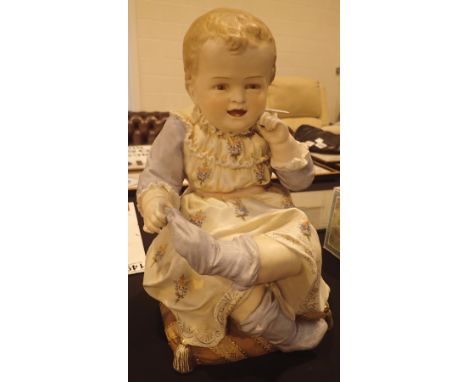 Antique continental bisque fired molded ceramic seated child figurine H: 30 cm CONDITION REPORT: Chip to childs right sock ot